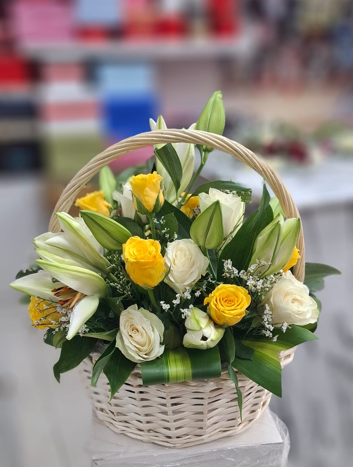 Sunshine Grace Flower Basket – White & Yellow Roses with White Lilies - FlowerSouq